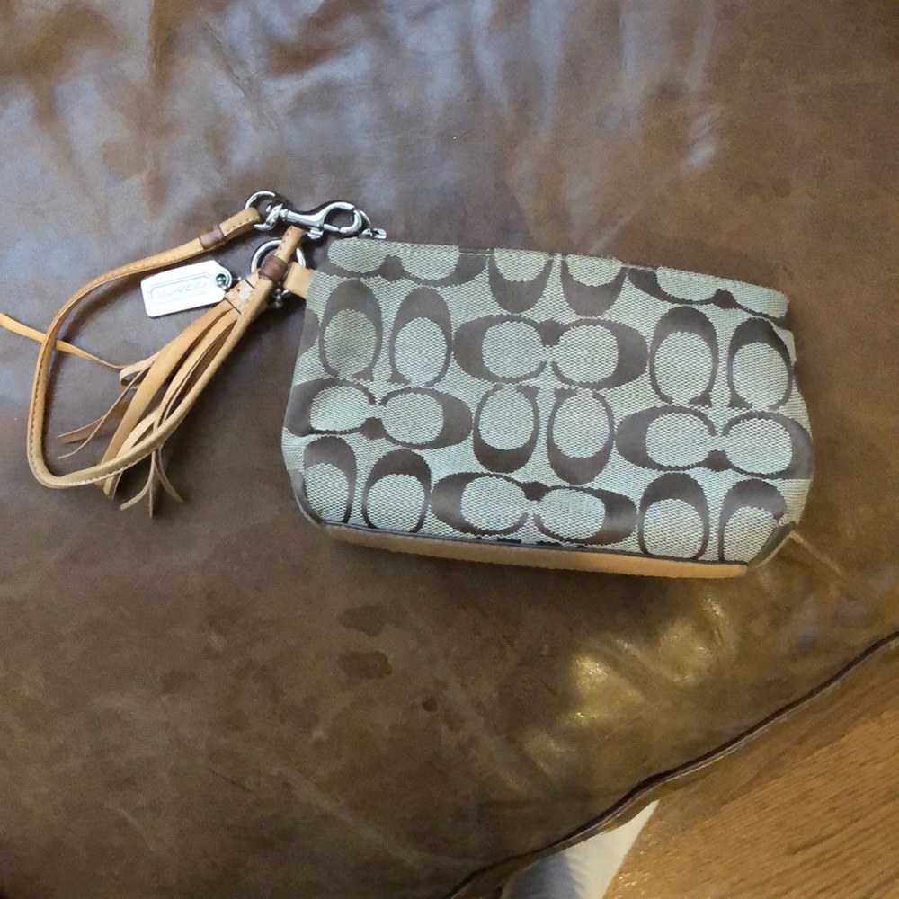 Coach wristlet with leather trim